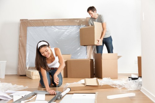 Furniture pick-up service removing a sofa in Wandsworth